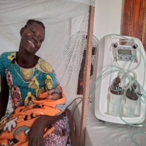 Oxygen concentrator The machine beside the mother and her new born baby