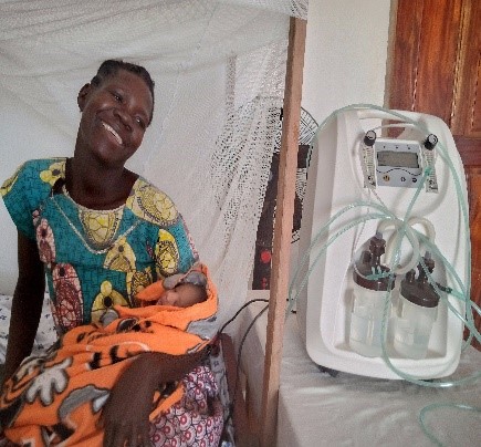 Oxygen concentrator The machine beside the mother and her new born baby