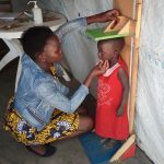 Evaline Poni - checking a child's development