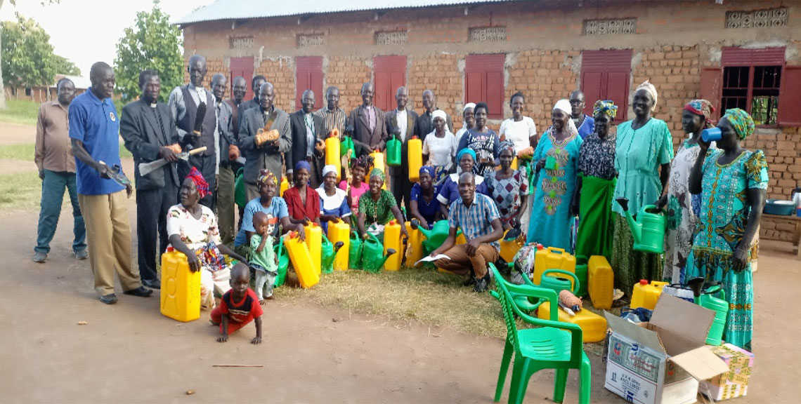 Group photo of Pastors in Mijale after receiving tools and seeds