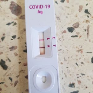A positive Covid-19 rapid tests strip