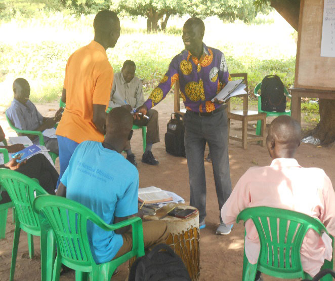 The CBFs with the Trainer during the session on discipleship.
