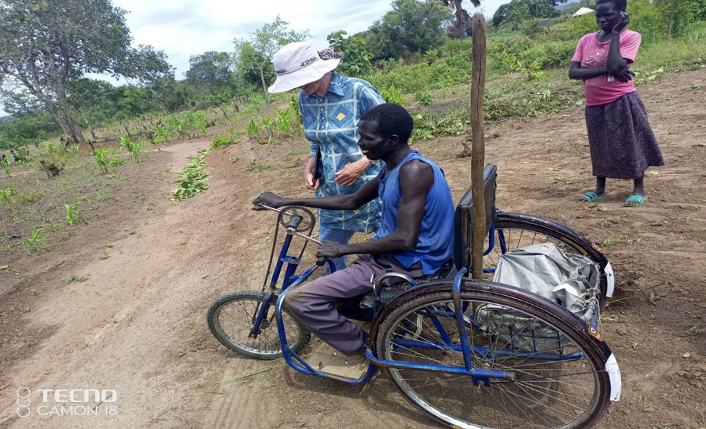 Olivia met Loku Morris, a disable on His wheel chair and member of Liu Salvation agric/savings group