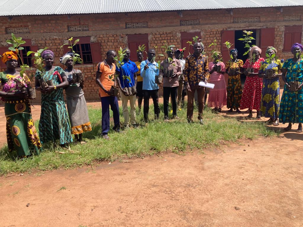 Mijale group members receiving their tree saplings